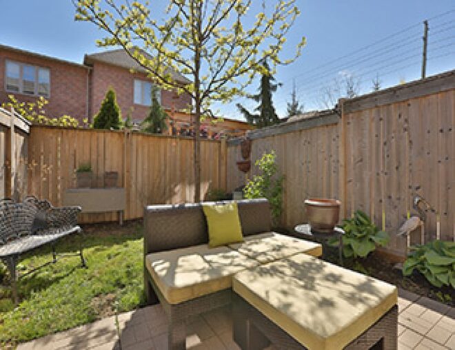 Cozy backyard patio with outdoor furniture.